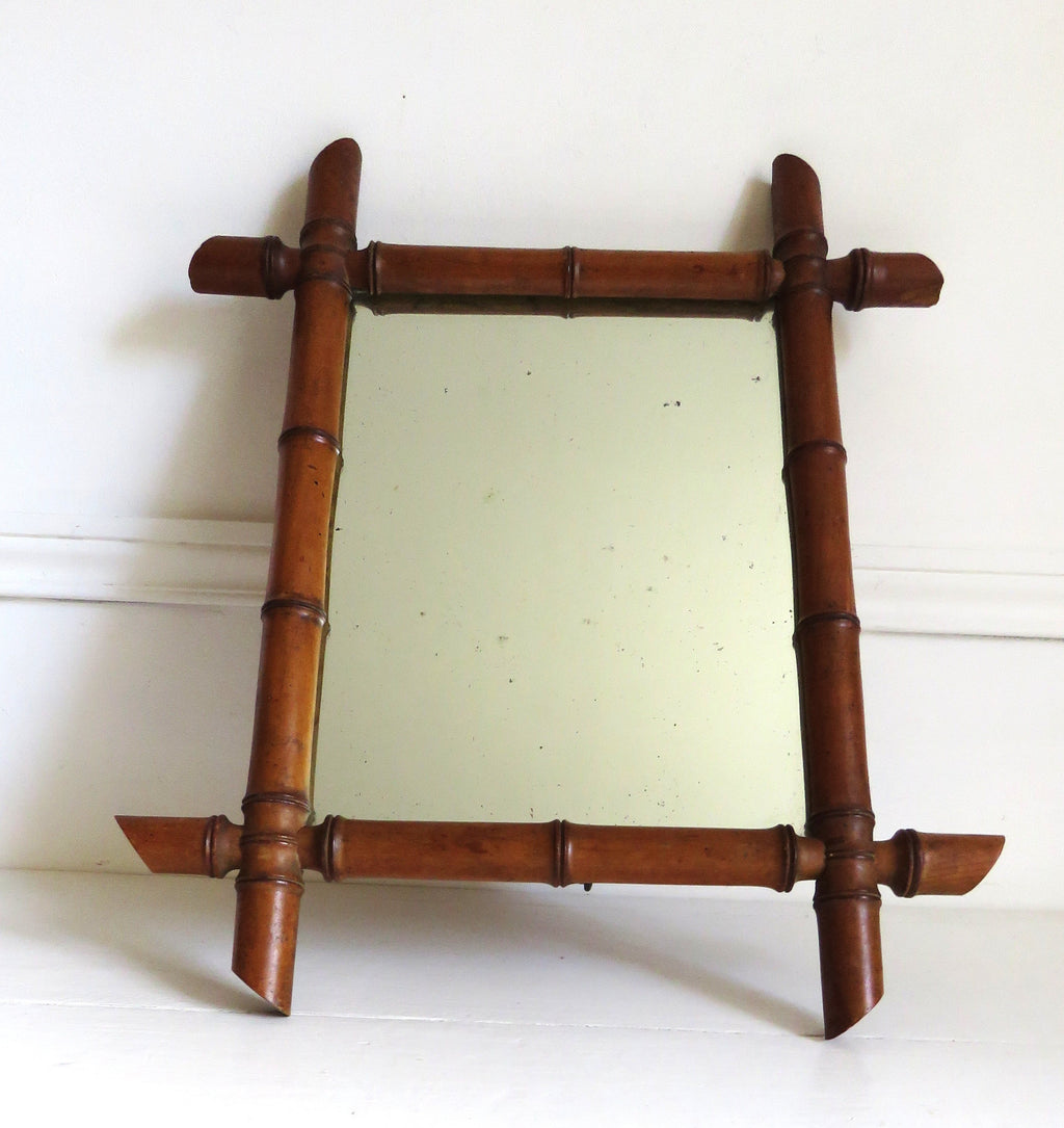 Vintage French mirror with a bamboo frame on a white background