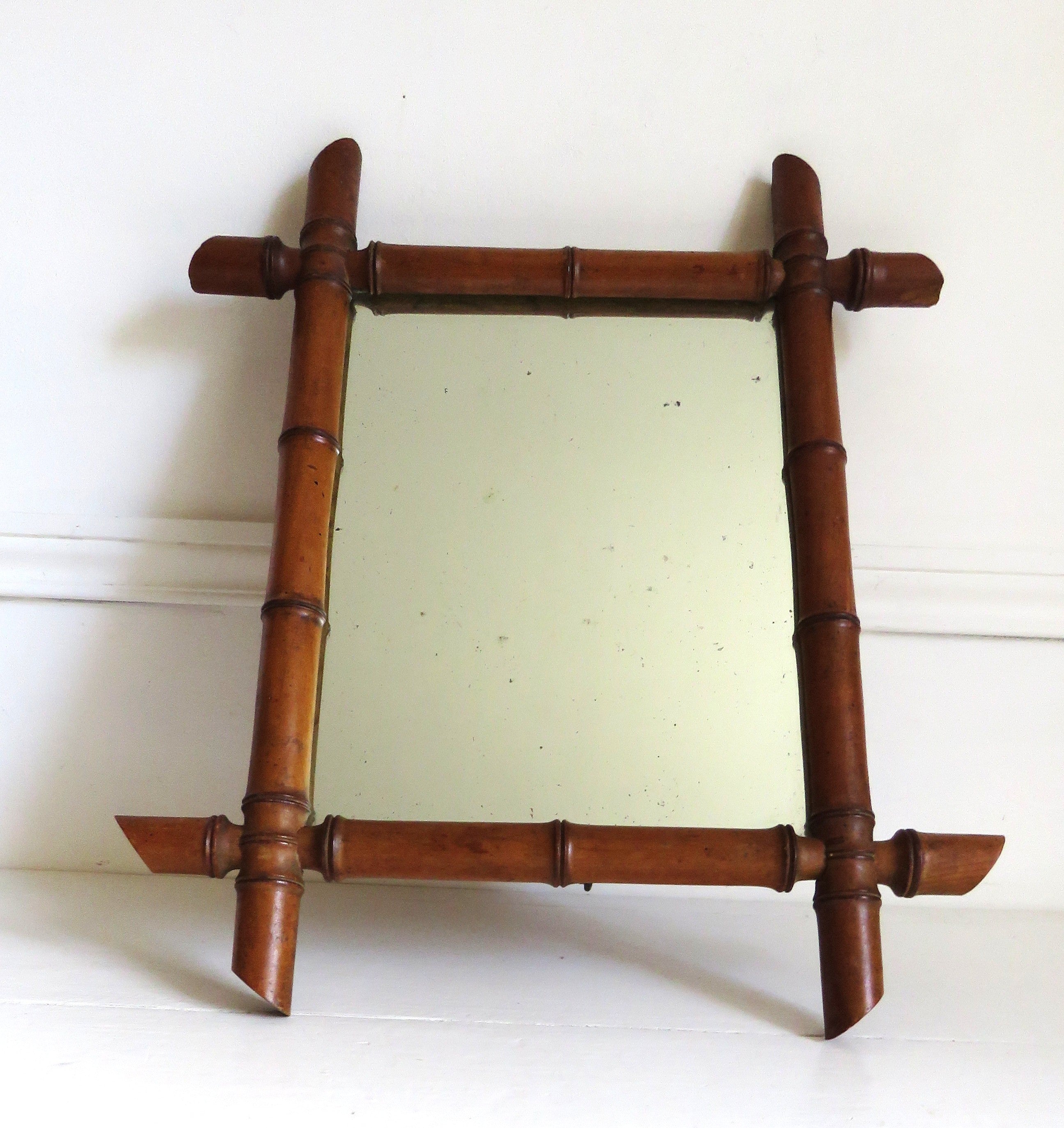 Vintage French mirror with a bamboo frame on a white background
