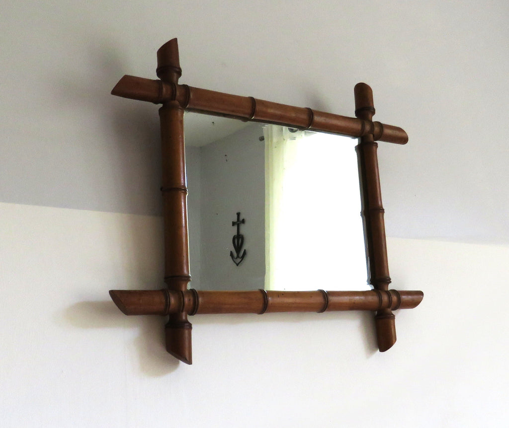 Vintage French mirror with a bamboo frame on a white background