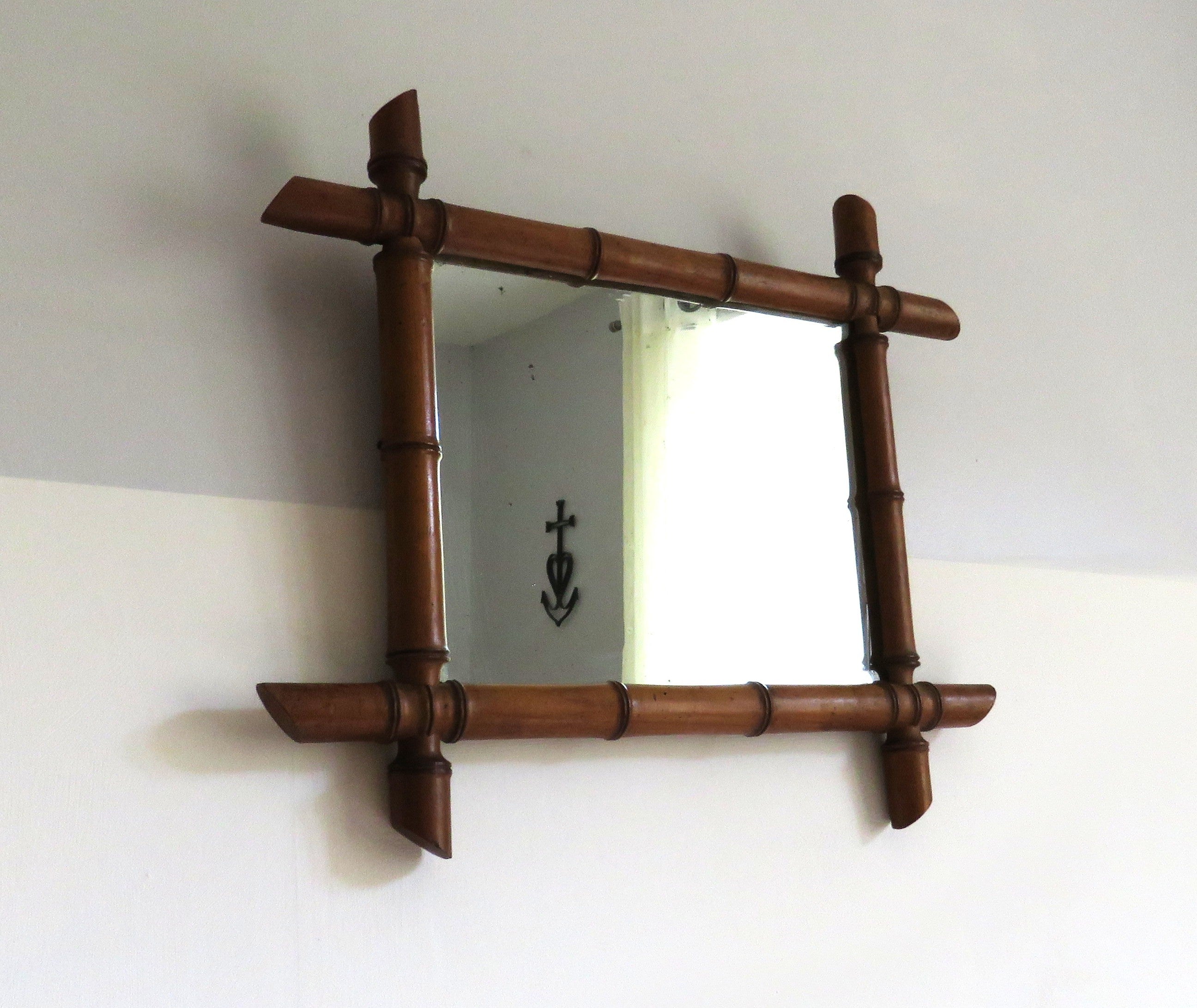 Vintage French mirror with a bamboo frame on a white background