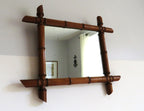 Vintage French mirror with a bamboo frame on a white background