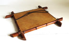 Back of a Vintage French mirror with a bamboo frame on a white background