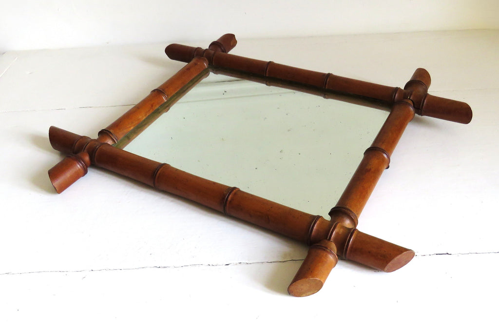 Vintage French mirror with a bamboo frame on a white background
