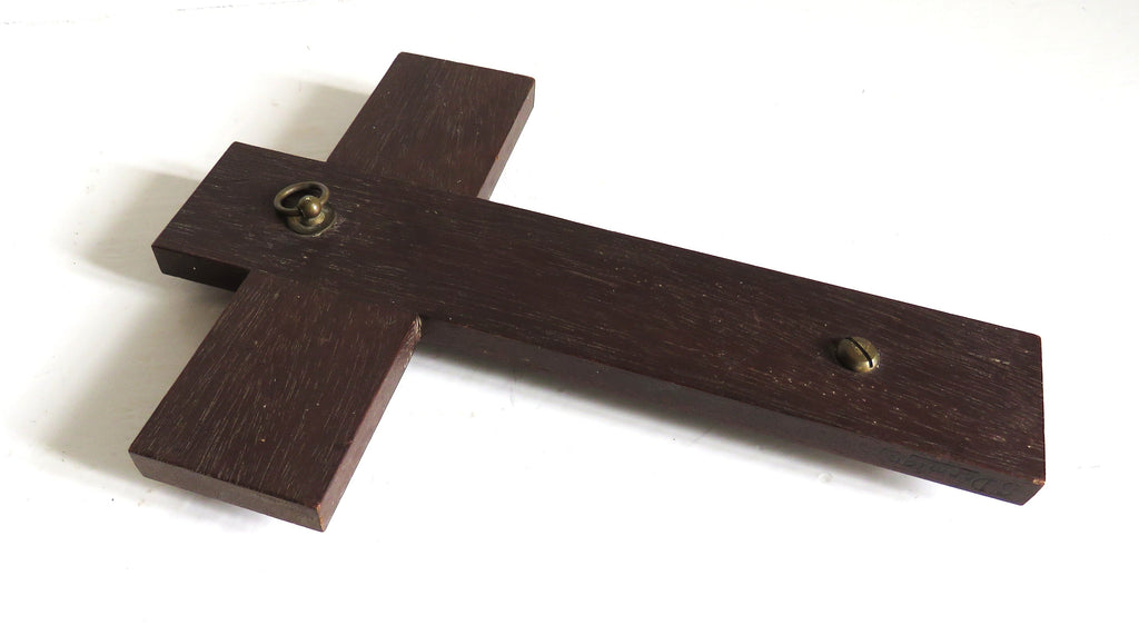 back of a Dermigny Bronze Crucifix on wooden cross on white background 