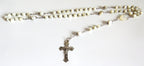 Mother of pearl rosary with silver crucifix on a wite background