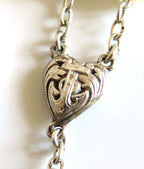 silver heart on a white background
