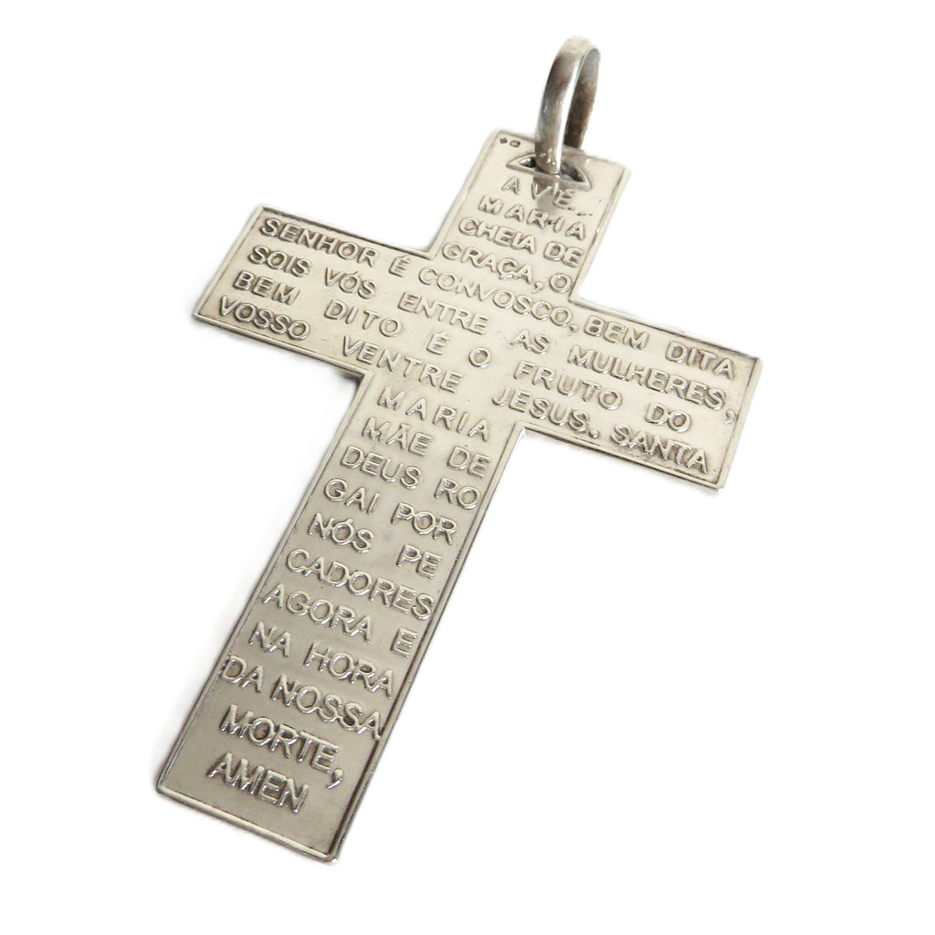 A silver cross pendant featuring engraved religious text, shown on a plain white background.