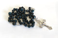 Bloodstone green rosary with a silver crucifix on a white background