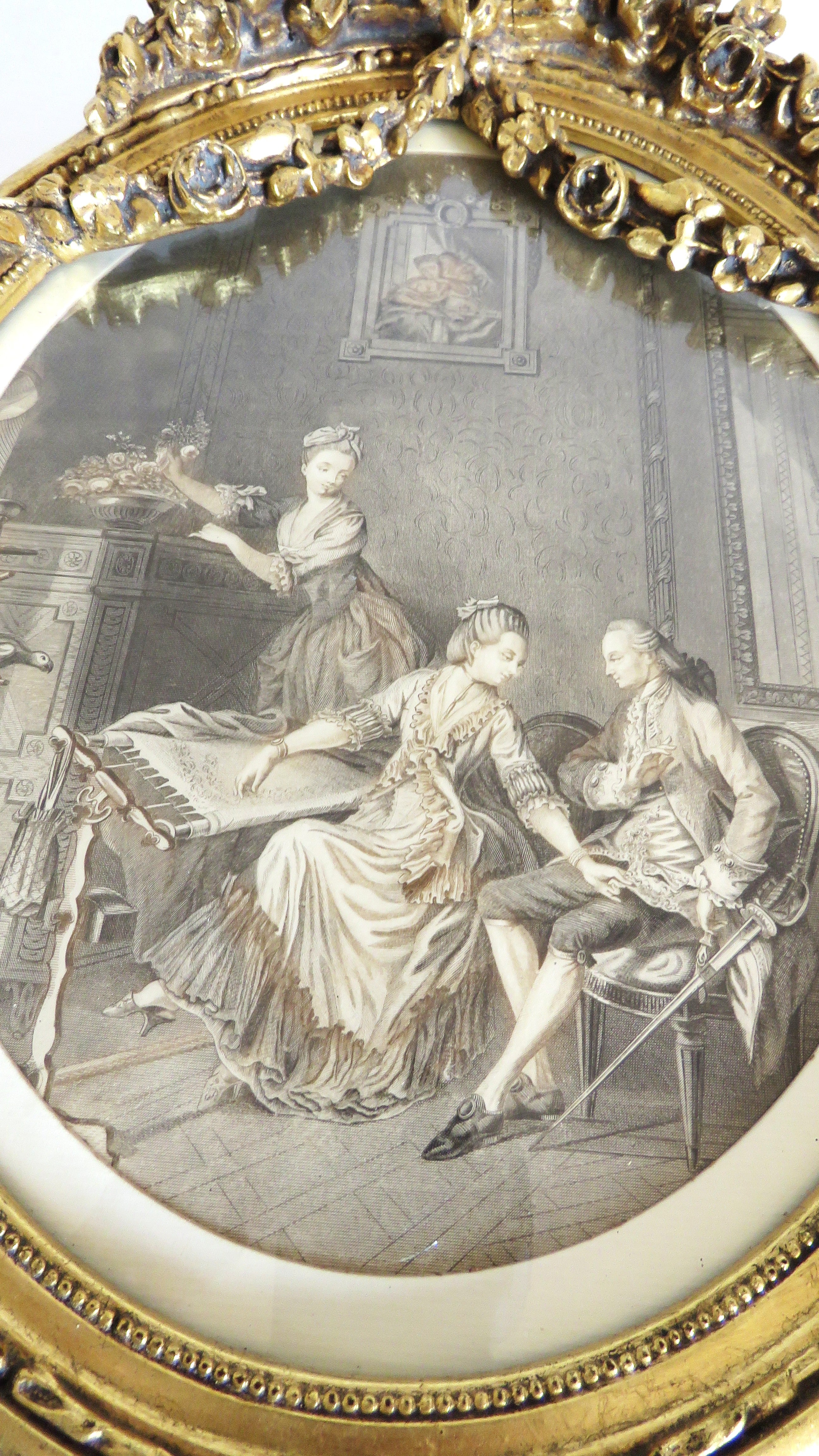 Decorative painting of a couple at a piano with intricate gold frame