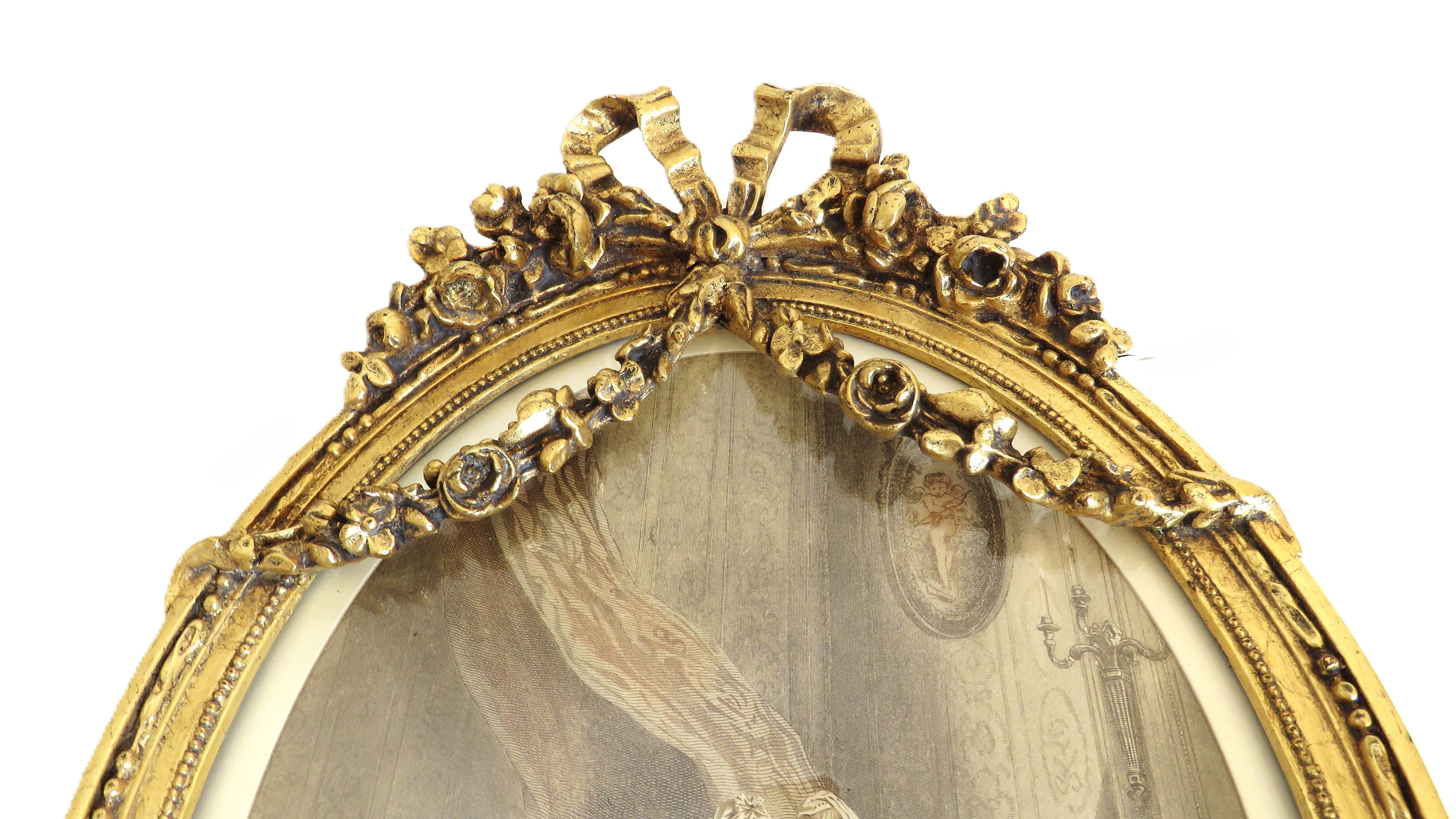 Decorative gold frame with intricate designs on a white background