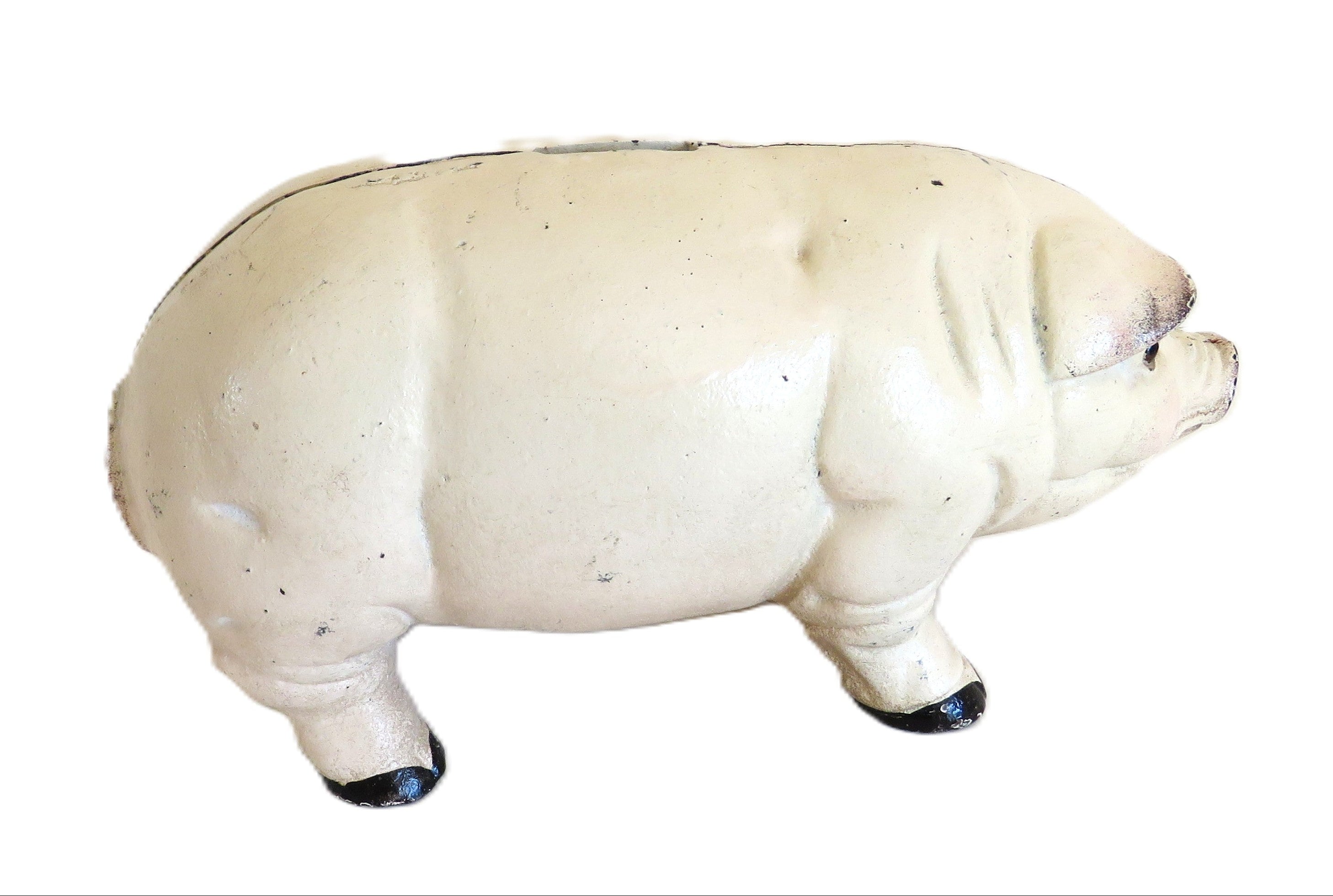 White cast iron piggy bank on a white surface