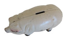 Pig-shaped money box on a white background