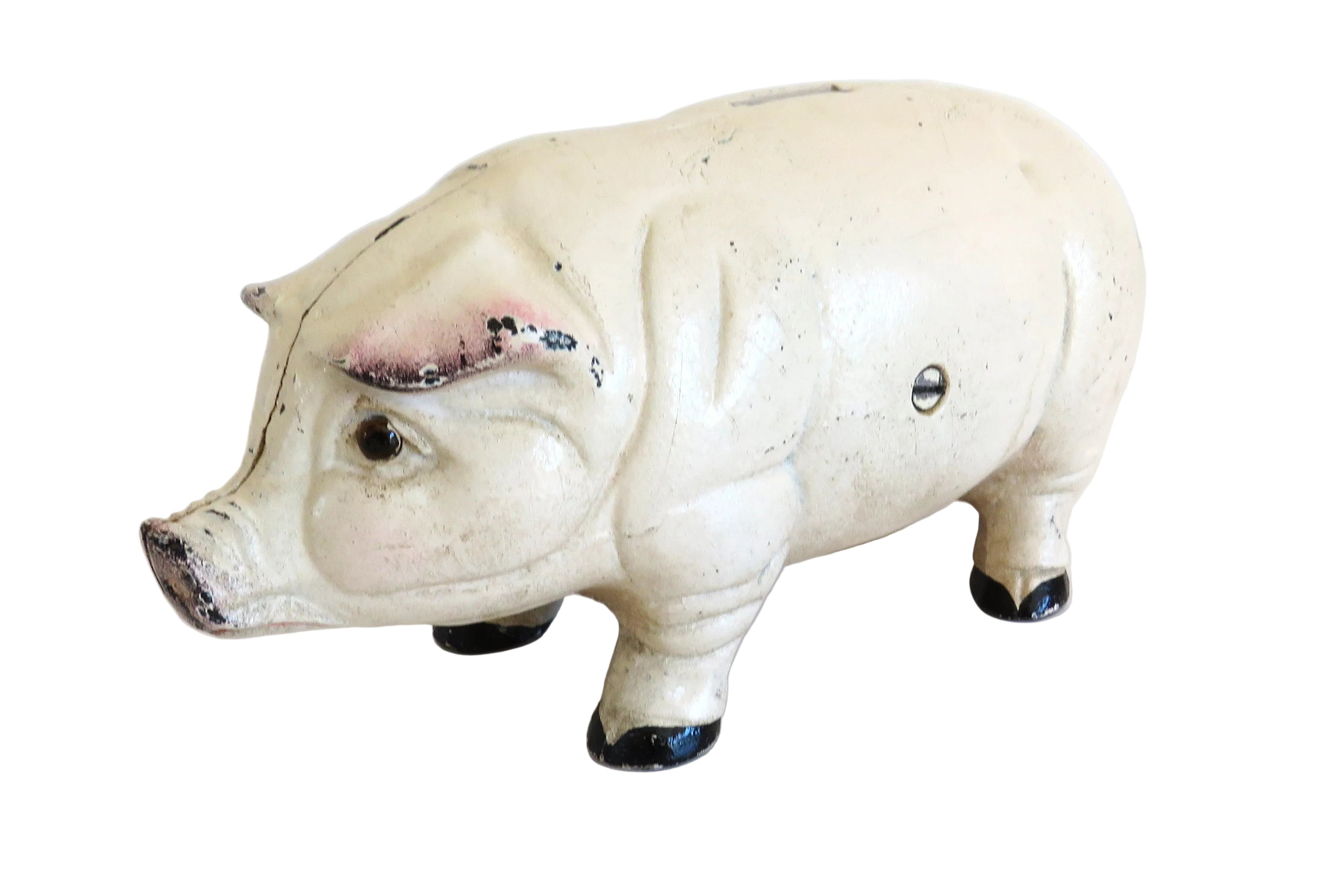 White cast iron piggy bank on a white surface