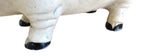 Close-up of a white pig figure with black hooves on a white background