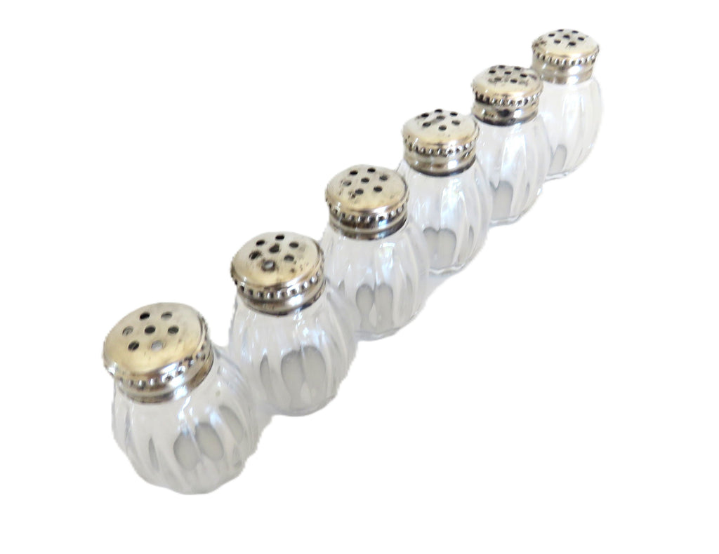Christofle six silver salts on a white background