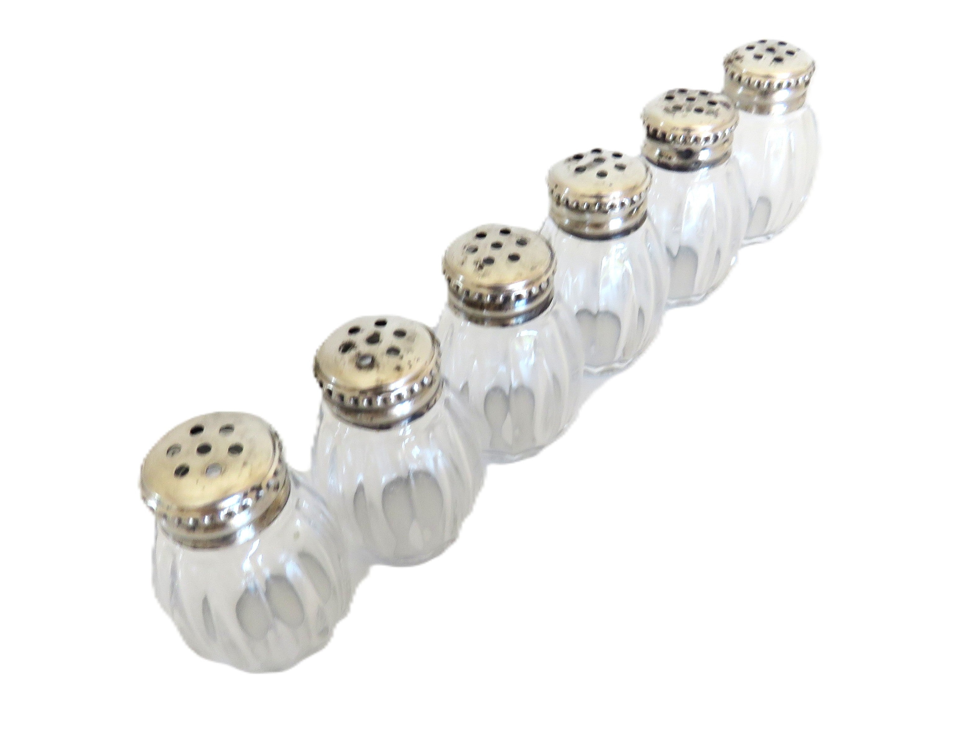 Christofle six silver salts on a white background