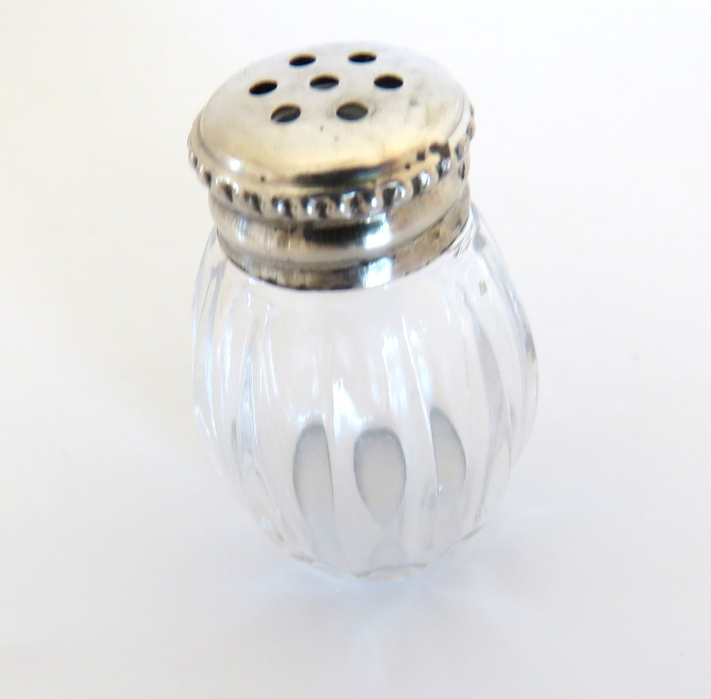 one silver and glass salt cellar