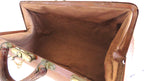 An open vintage brown leather doctors bag with a matching brown fabric lining and brass-tone latches, shown against a white background.