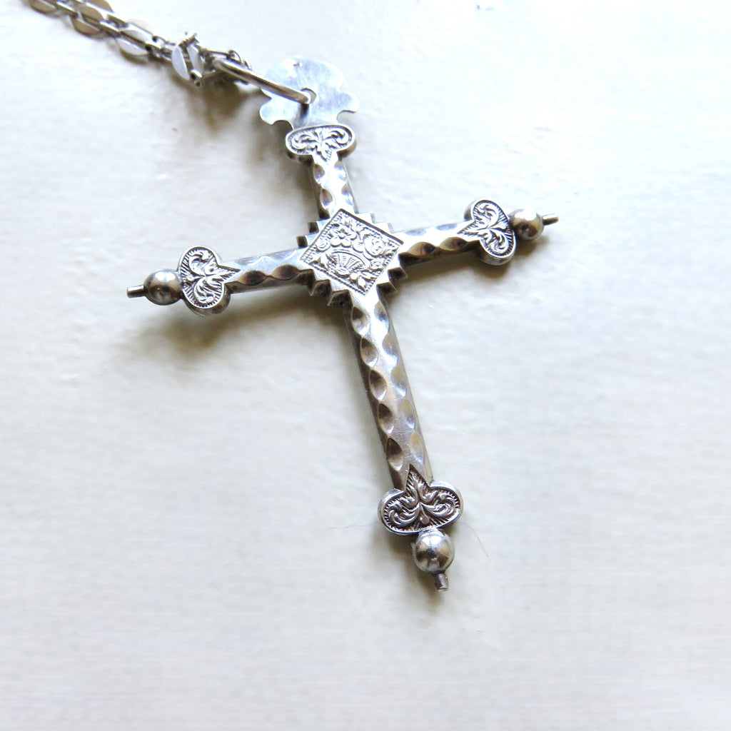 silver cross on white background
