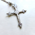silver cross on white background
