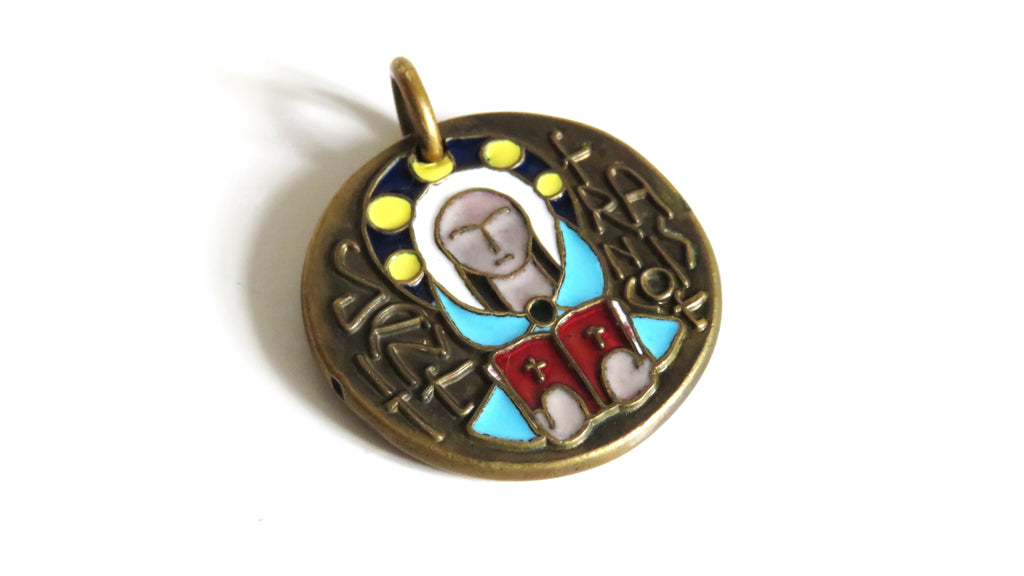 A round antique-style metal pendant with an embossed figure and colorful enamel details in blue, red, yellow, and white, set against a plain white background.